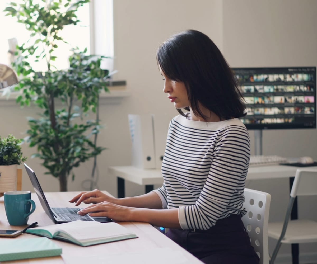 Woman typing on laptop